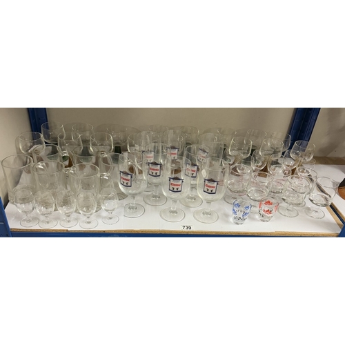 739 - A large lot of pub glasses including some branded