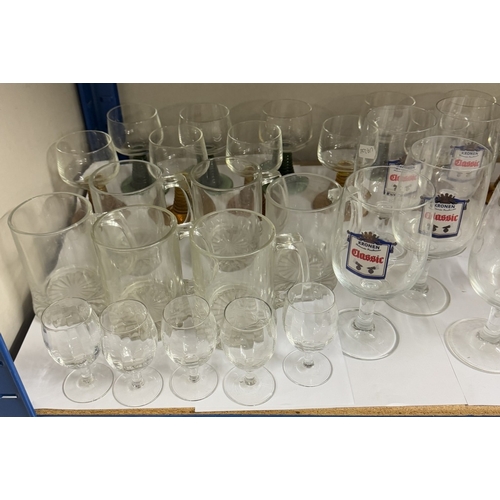 739 - A large lot of pub glasses including some branded