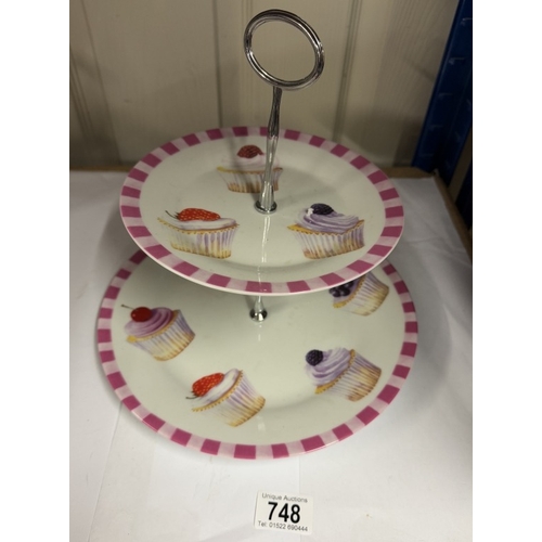 748 - A Leonardo collection 2 tier cake stand decorated with cup cakes