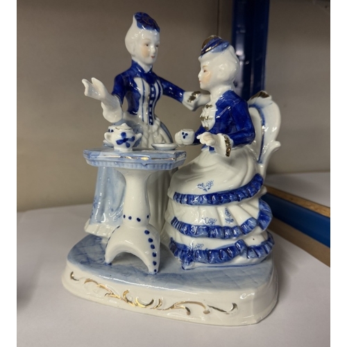 759 - A blue & white ceramic classical figurine group