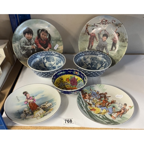 768 - 4 Oriental themed plates & a bowl