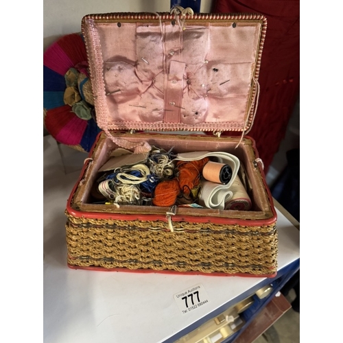 777 - A mid 20th century sewing box with contents, in good condition.