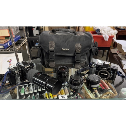 782 - 2 Minolta cameras with 4 lenses & carry bag