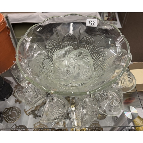 792 - A glass punch bowl with cups.