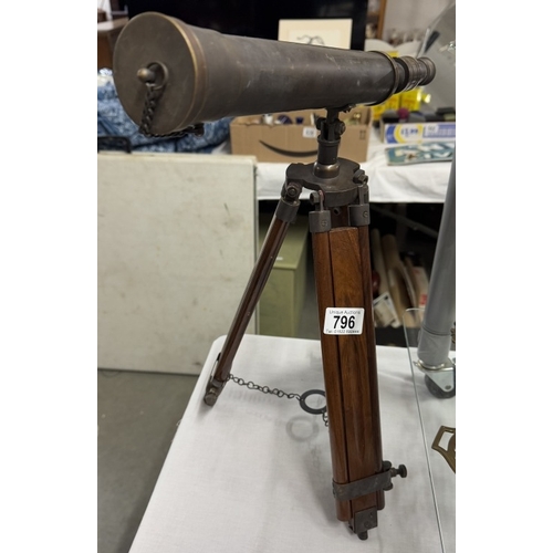 796 - A brass telescope with patina to surface on teak tripod