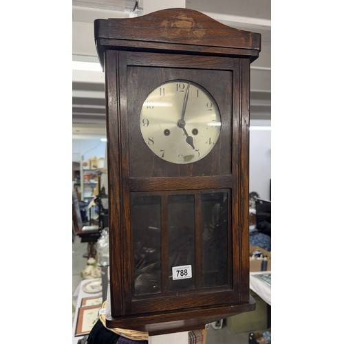 788 - A 1930s oak wall clock