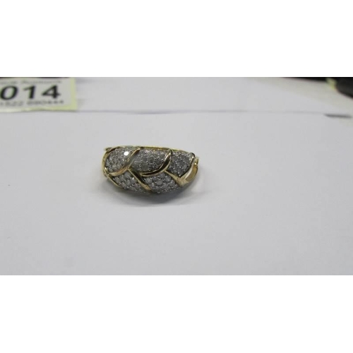 1014 - A four section diamond panel ring, size R, 2.98 grams