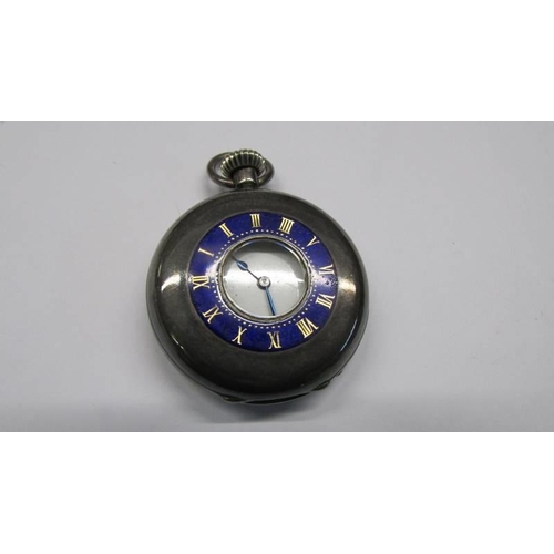 1027 - A small monogrammed silver pocket watch.