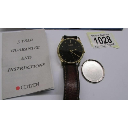 1028 - A Buren gent's wrist watch with guarantee and a Citizen Quartz gent's wrist watch (loose back).