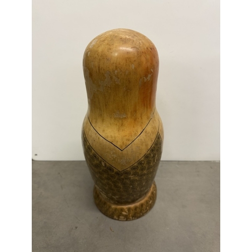 821 - A large wooden Russian doll bottle holder