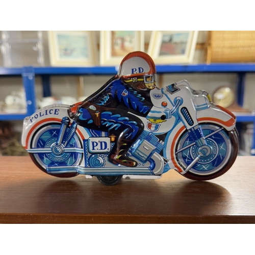 826 - A Japanese tinplate friction police motorcycle