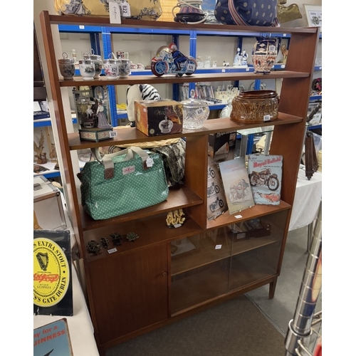 830E - A retro teak wall unit with cupboard and glazed bookcase