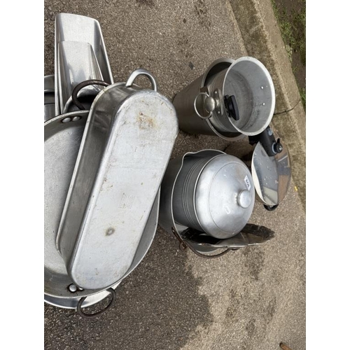 858 - A quantity of metal kitchen items including Jam pan, pressure cooker etc