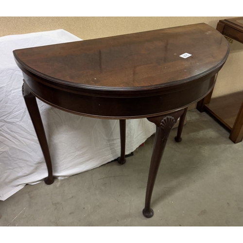 905 - A Victorian mahogany 'D' shaped fold over games table.