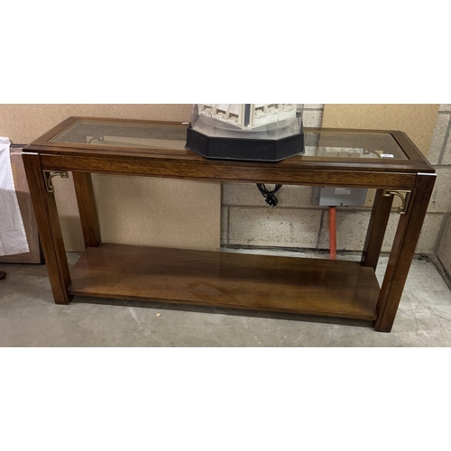 907 - A mahogany hall table with glass top