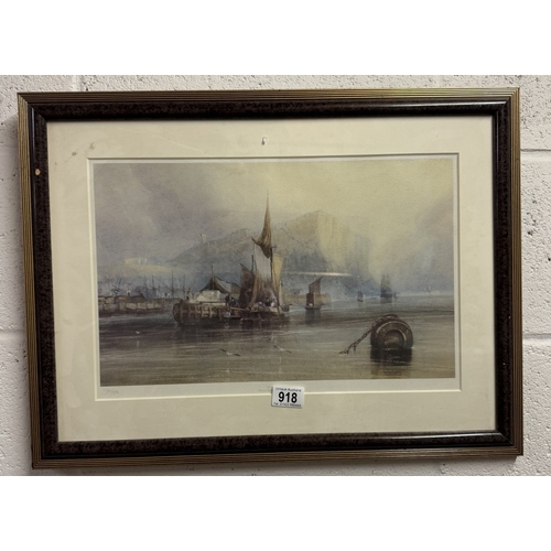 918 - A framed and glazed print featuring fishing boats.