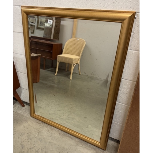 919 - A gilt framed bevel edged mirror.