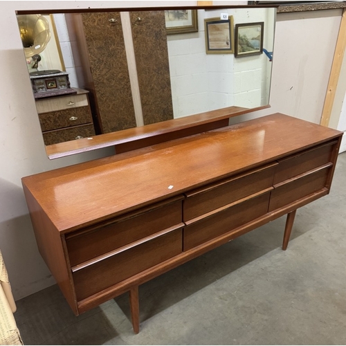 926 - A 1970s mirror back teak sideboard