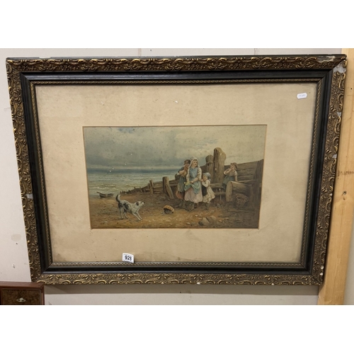 928 - A framed and glazed beach scene with family.