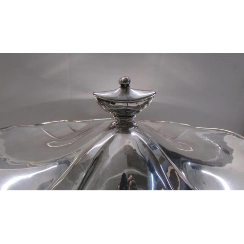 1051 - A magnificent twin handled silver plate soup tureen.