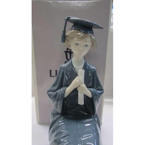 1055 - A boxed Lladro figure - Lady Graduate.