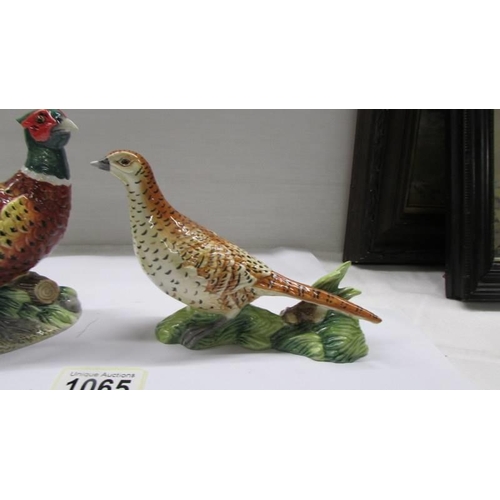 1065 - A pair of John Beswick male and female pheasants.