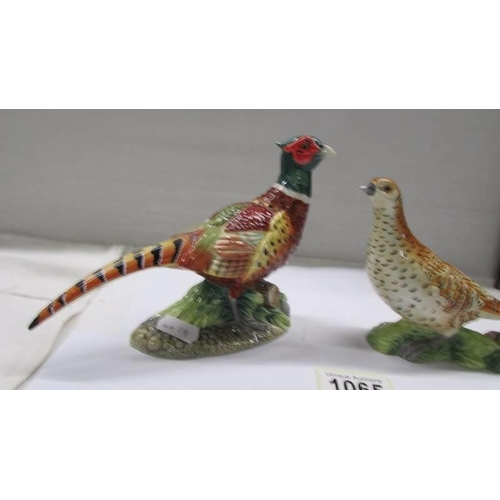 1065 - A pair of John Beswick male and female pheasants.