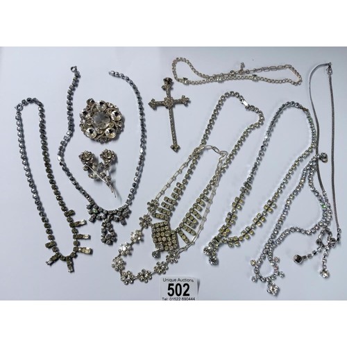 502 - Eight pieces of diamonte' jewellery including cross pendant.