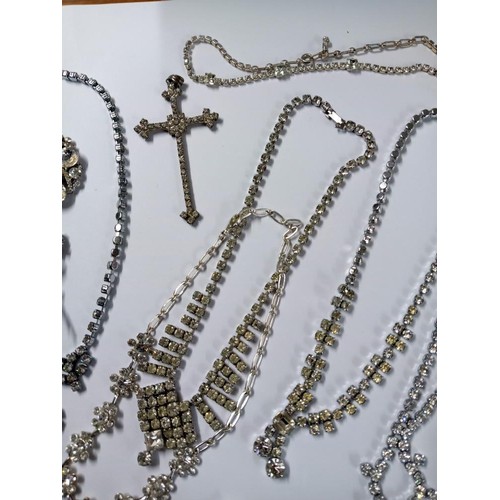 502 - Eight pieces of diamonte' jewellery including cross pendant.