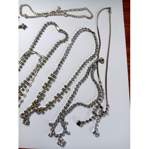 502 - Eight pieces of diamonte' jewellery including cross pendant.