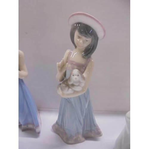 1220 - Four boxed Lladro figurines.