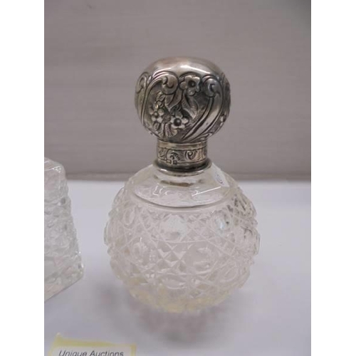 1227 - A silver topped scent bottle and one other.