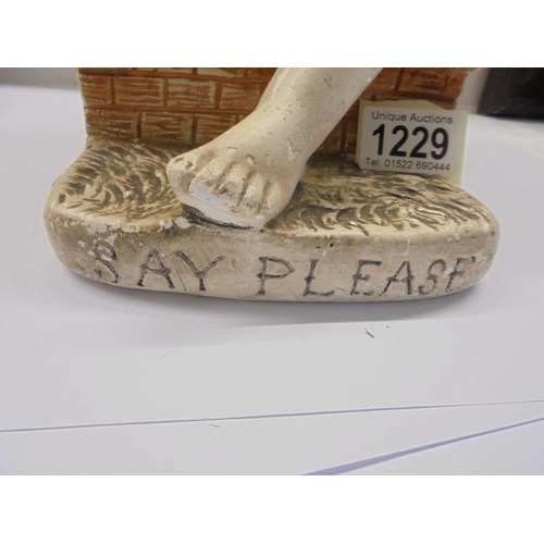 1229 - A vintage chalkware figure of a seated girl with dog 'Say Please' . Reg no 765573 LMC 47G