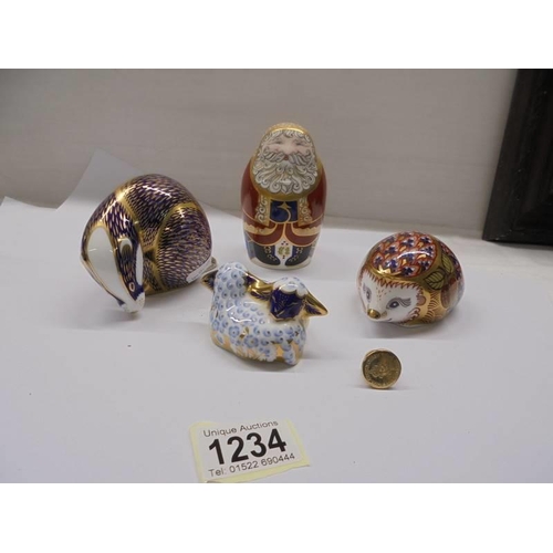 1234 - Four Royal Crown Derby paperweights including Santa Clause (3 silver, 1 gold stoppers).