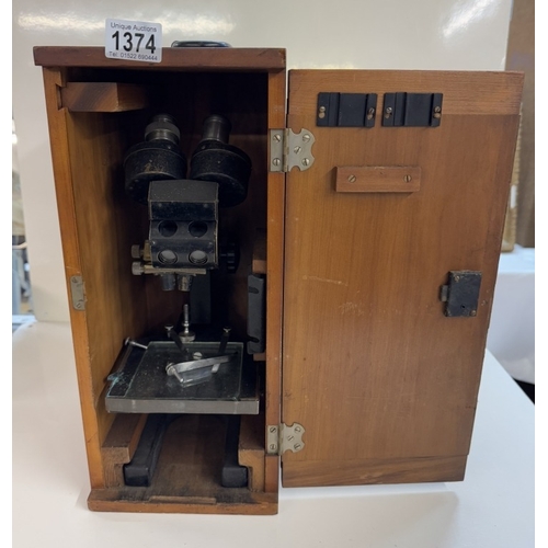 1374 - A cased Bausch & Lomb USA 310005 microscope