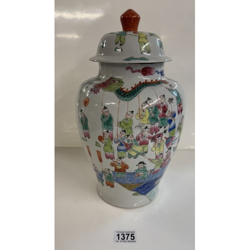 1375 - A Chinese Famille rose vase with oriental people pattern