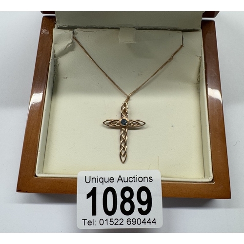 1089 - A Clogau stone set gold cross on chain, 3.6 grams.