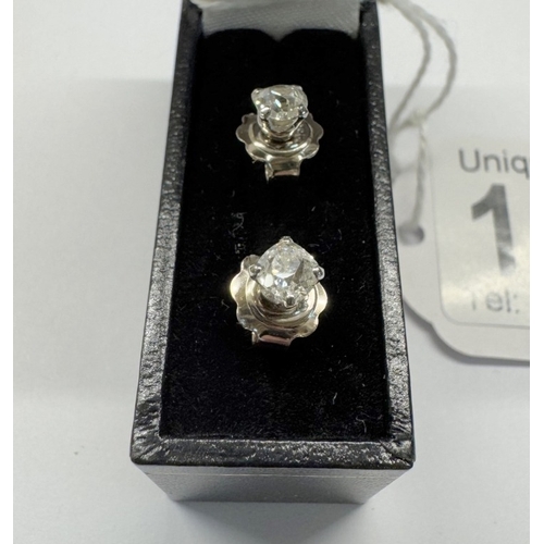 1091 - A pair of old mine cut diamond stud earrings, 0.6ct total in 18ct gold.