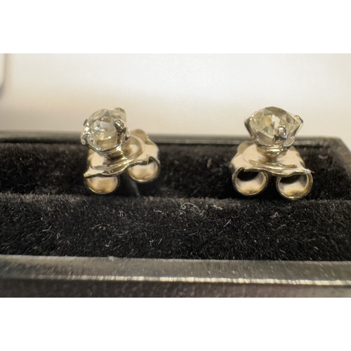 1091 - A pair of old mine cut diamond stud earrings, 0.6ct total in 18ct gold.