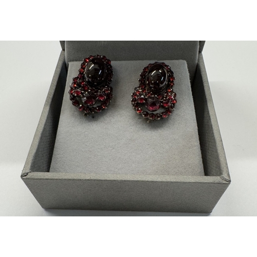 1097 - A pair of 19th century garnet stud earrings, cabochon cut garnets, centre stone, yellow metal set.