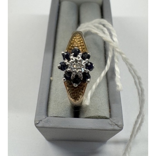 1101 - A diamond and sapphire cluster ring, dated Sheffield 1979, 9ct gold, size L, 2.15 grams.