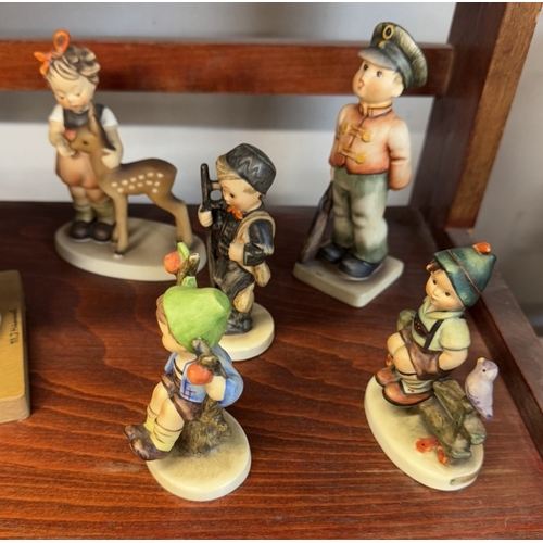 1245 - A collection of Hummel/Goebel items including figurine book ends, 7 figurines & plate box etc.