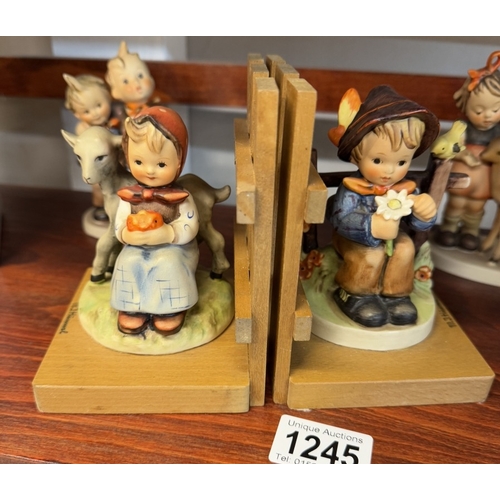 1245 - A collection of Hummel/Goebel items including figurine book ends, 7 figurines & plate box etc.