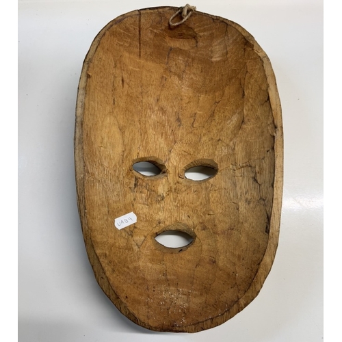 1247 - A carved wood tribal mask