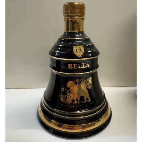 1249 - 2 rare boxed Bells Whisky decanters, Hawaii 12 years old deluxe whiskey & year of the sheep 1991