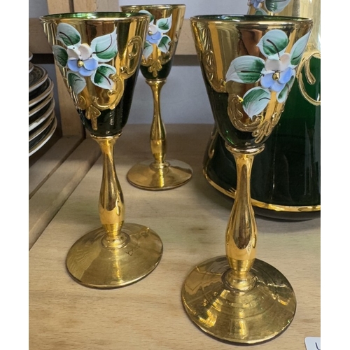 1257 - A green glass & gilt decanter with 6 glasses