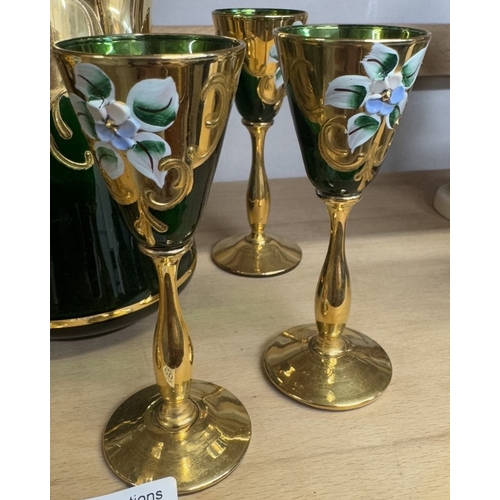 1257 - A green glass & gilt decanter with 6 glasses