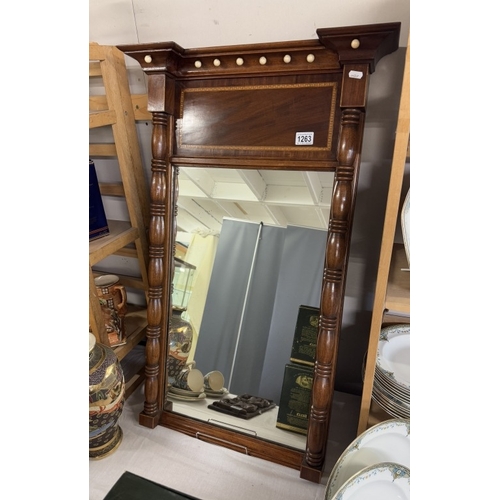 1263 - An antique mahogany wall mirror