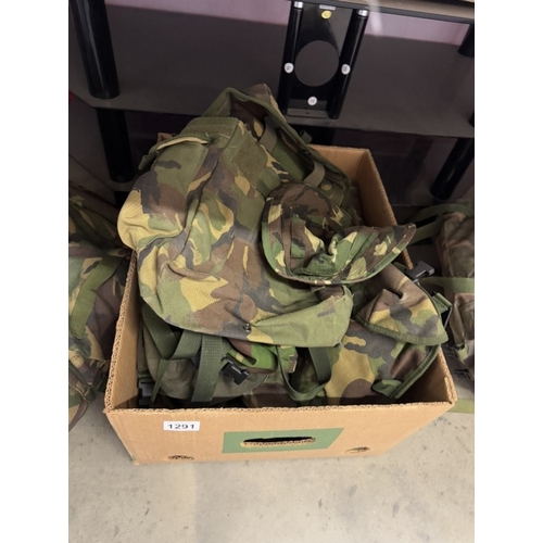 1291 - A quantity of camouflage back packs etc. including webbing & pouches etc.