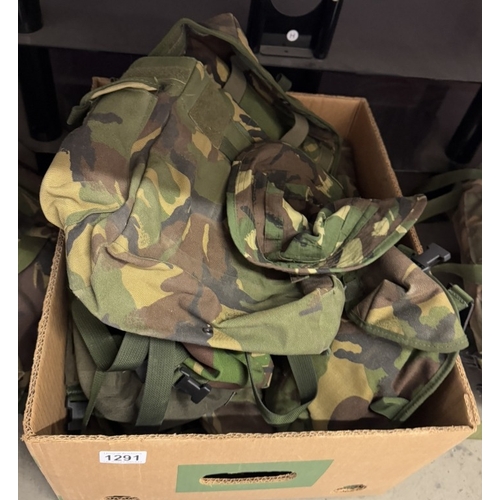 1291 - A quantity of camouflage back packs etc. including webbing & pouches etc.